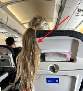 A girl on the plane threw her hair over my seat, blocking my screen: I had to teach the rude woman a lesson
