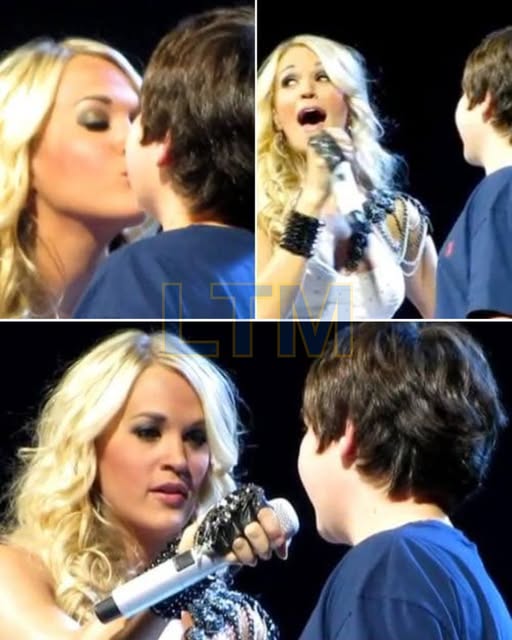 “He asked… and she actually said yes.” It started with a handmade sign and a whole lot of courage. In the middle of Carrie Underwood’s sold-out show in Louisville, a young fan stood up and held his message high—and suddenly, the music faded into the background. The crowd quieted. Carrie noticed. And then, with that familiar sparkle in her eye and a grin that could melt stone, she walked right toward him. One kiss. One stunned little boy. One arena bursting into cheers.