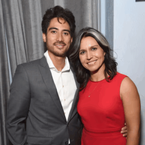 Tulsi Gabbard’s husband, Abraham Williams, proposed to her on a surfboard — but the ring almost slipped into the ocean during the moment, making the proposal far more dramatic than anyone could have imagined. The full story would shock everyone.