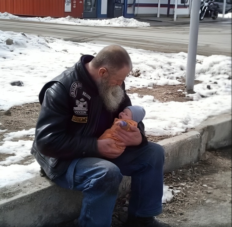 Biker carried a newborn for 8 hours through a blizzard after finding her abandoned in a gas station bathroom.