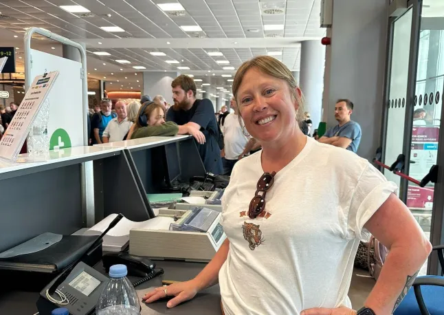 Mum takes over crowded airport’s PA system and helps board eight planes
