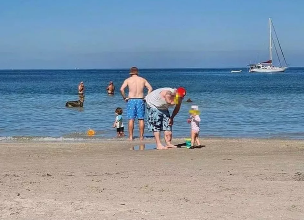 Beach family photo goes viral after viewers spot terrifying detail