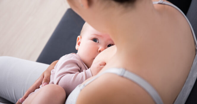 Mom responds to backlash after photo breastfeeding toddler