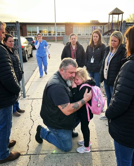 A Tattooed Biker Hugged a Crying Little Girl Outside a School Gate — Minutes Later Her Mother Arrived and Broke Down When She Realized Who He Was