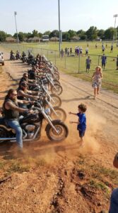 A Boy Stood Alone on the Field and Blocked a Line of Bikers — What He Knew Made Them Slam Their Brakes