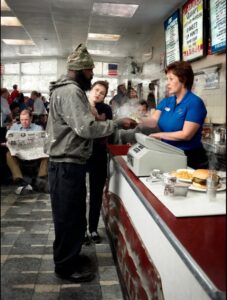 Successful Businessman Finds Secret Hero Working Hard At His Local Diner