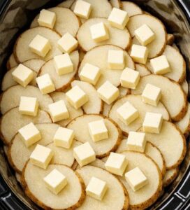 Toss raw sliced russet potatoes into the slow cooker with just 3 other ingredients and somehow you get a cozy dinner your family will ask for again.