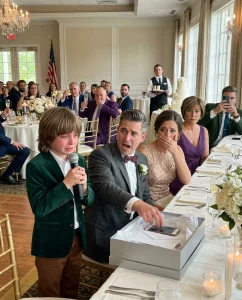 My ex ch3ated, abandoned me and our son, then invited us to his wedding. During his speech, he laughed, “Leaving that trash behind was my best decision.” Everyone laughed until my son took the mic and handed him a “gift.” One second after opening it, his scream silenced the room.