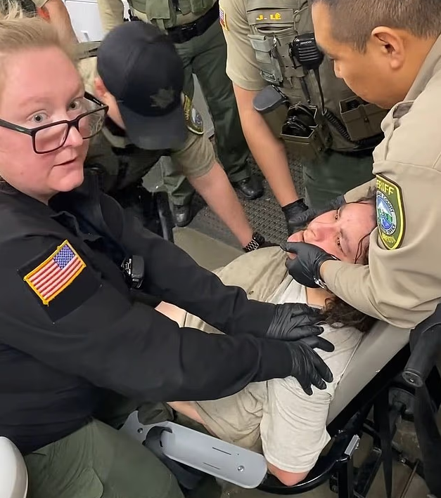 Woman, 47, arrested over KFC incident filmed telling cops 'I can't breathe' as she was booked into jail... moments later she was dead